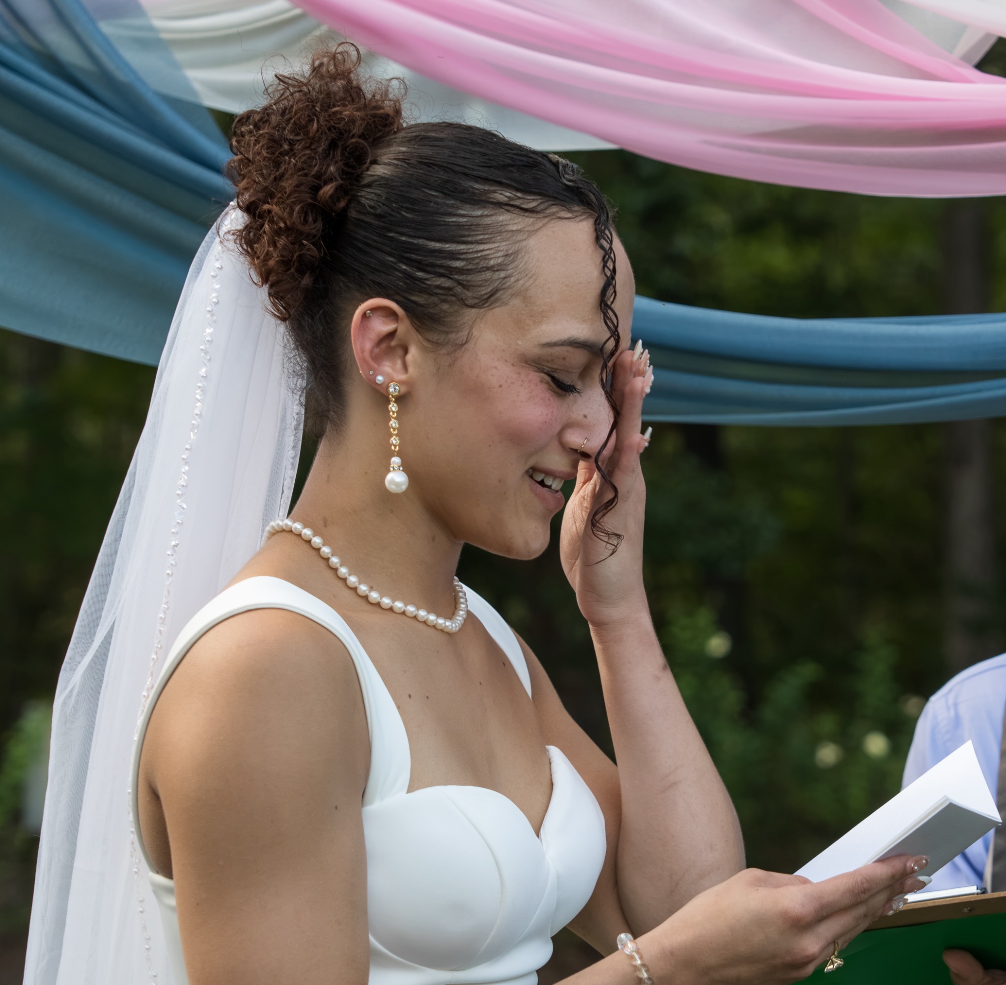 Bride smiling with emotion during the ceremony
