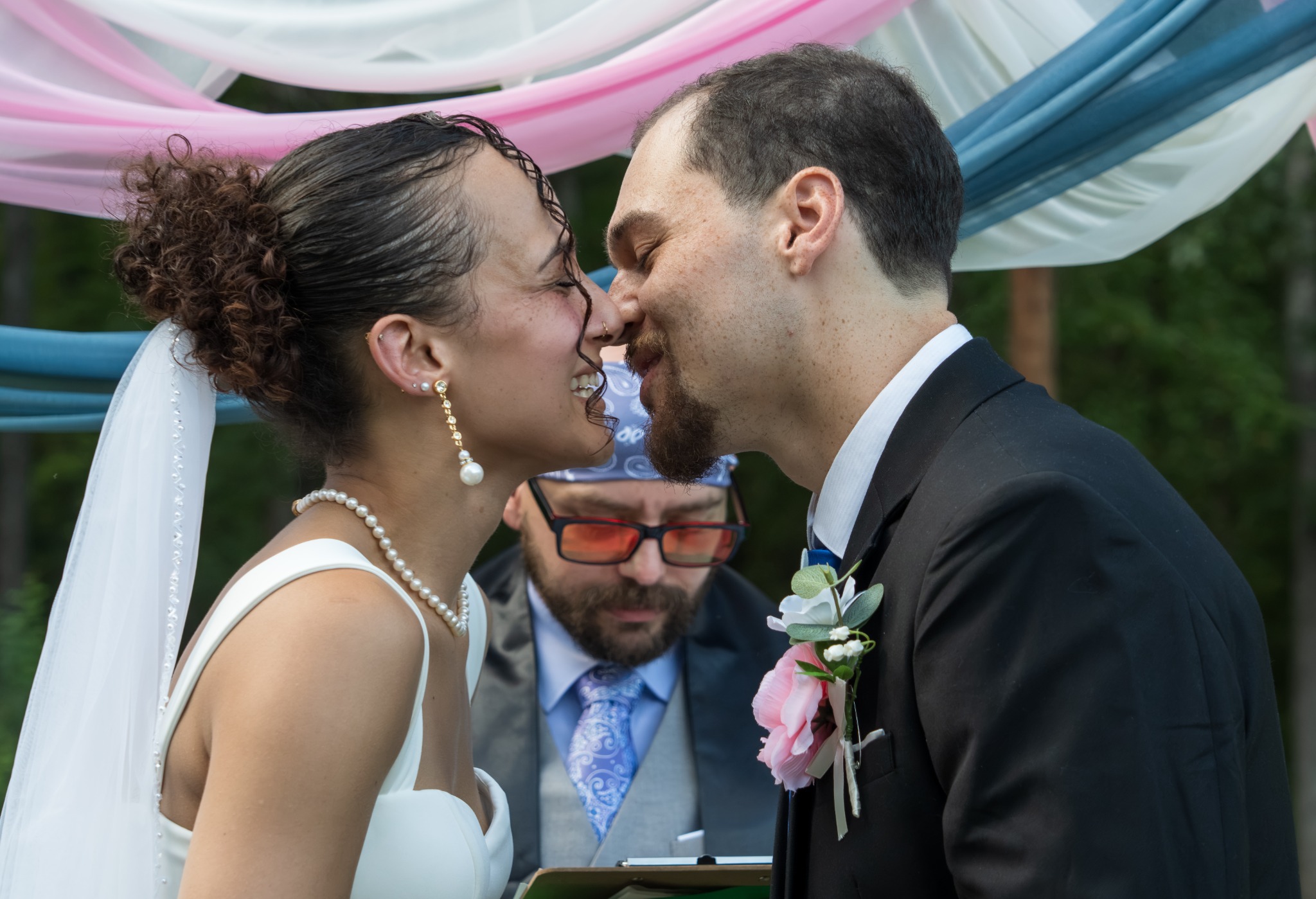 Bride and groom smiling close together