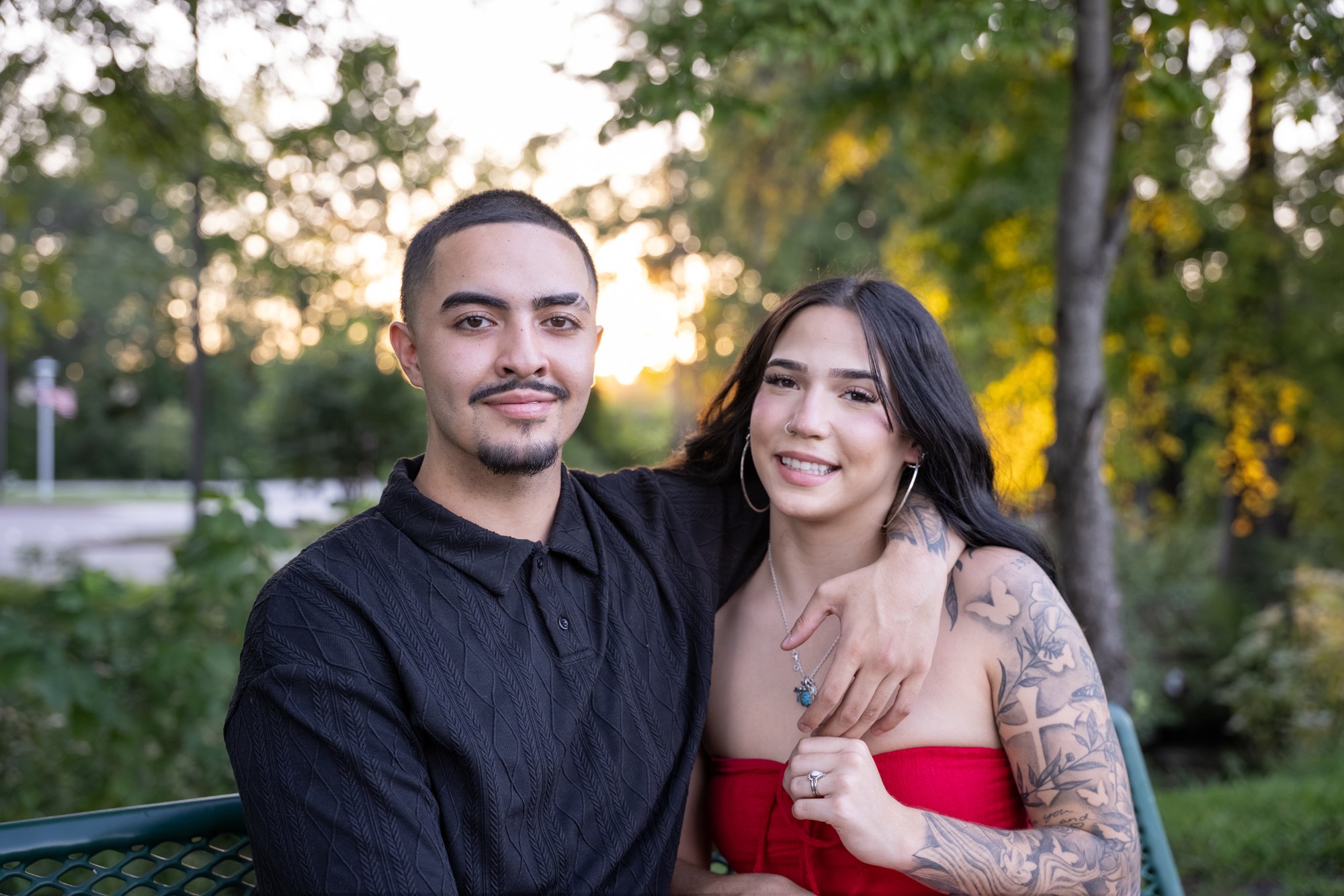 Couple seated together in warm evening light