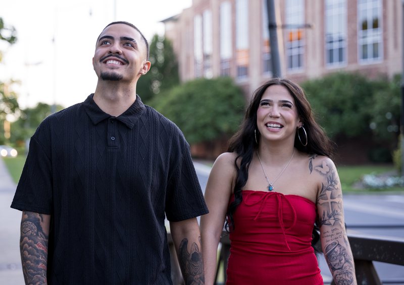 Couple sharing an upward glance and smiling