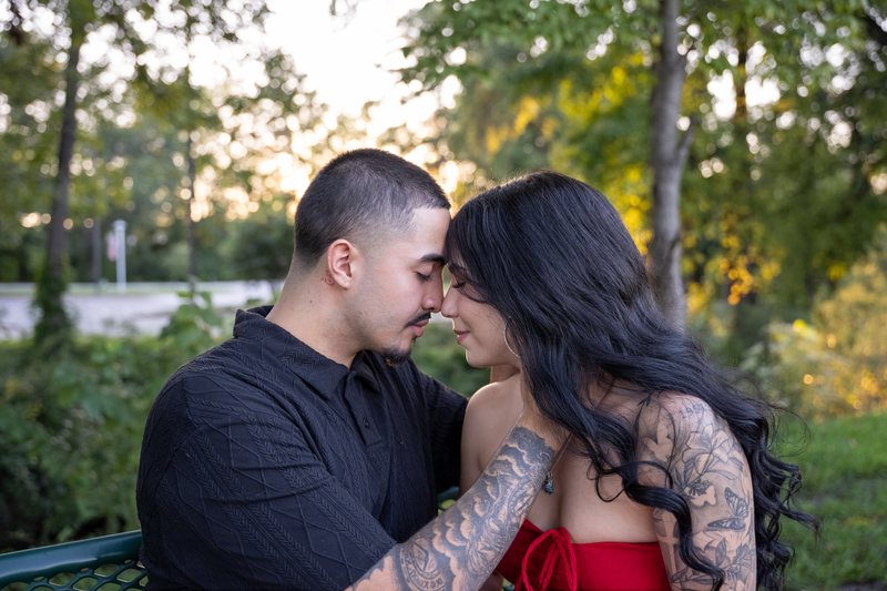 Couple resting their foreheads together at sunset