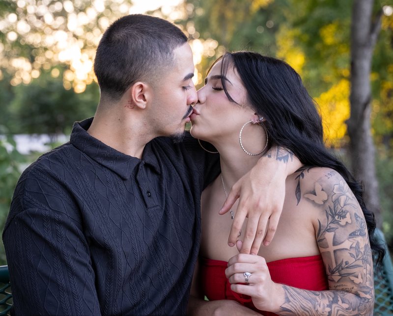 Close portrait of a couple kissing with the ring visible