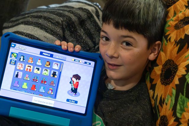 Young guest holding a tablet