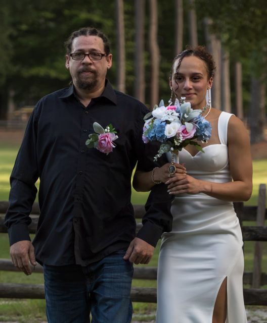 Bride walking with her escort
