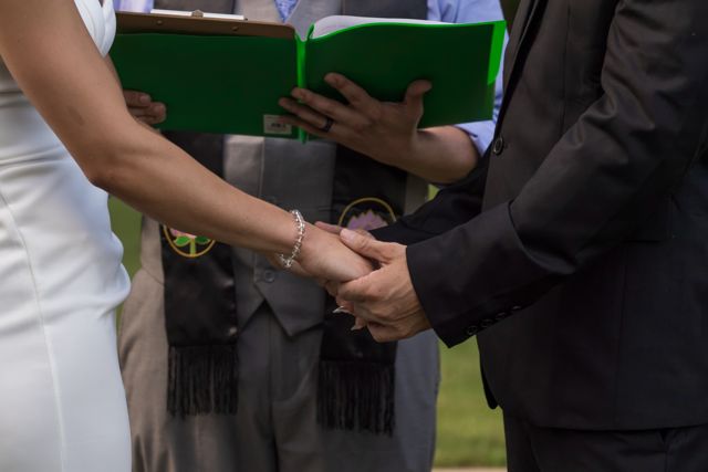 Bride and groom holding hands
