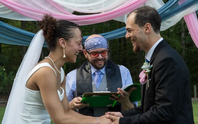 Bride and groom laughing during the ceremony