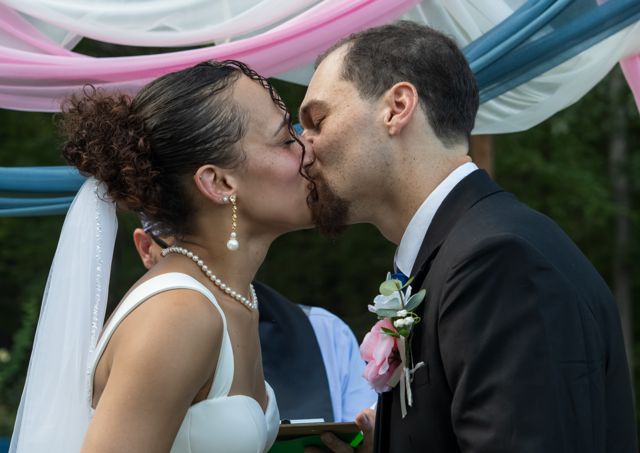 Bride and groom kissing