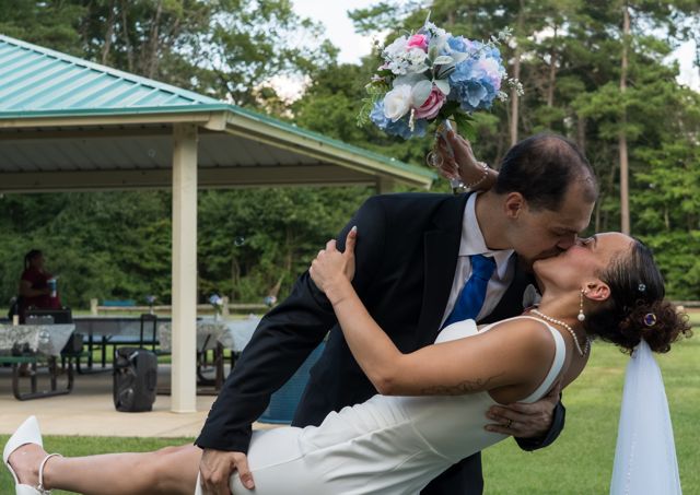 Groom dipping the bride for a kiss