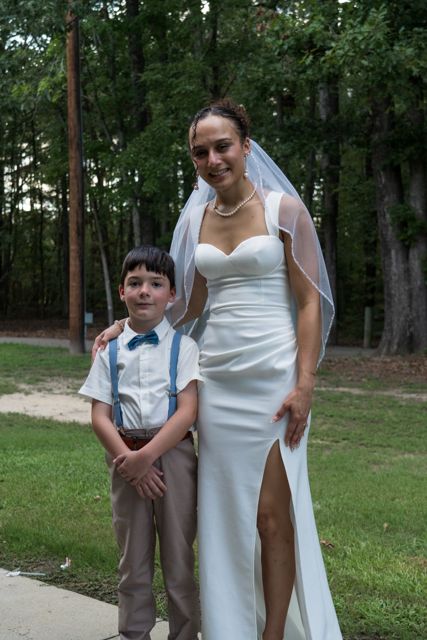 Bride posing with a young guest