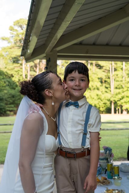 Bride posing with a young guest