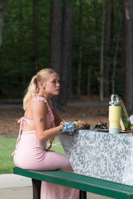 Guest beside the wedding cake