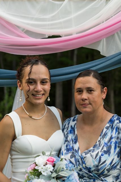 Bride posing with wedding guests