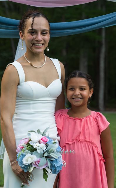 Bride posing with wedding guests