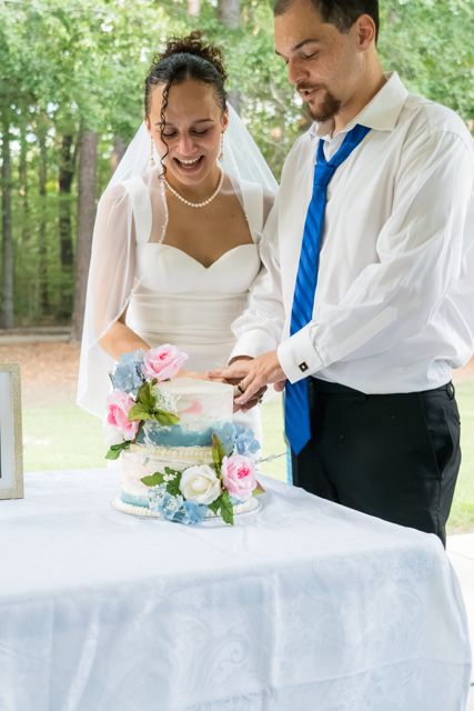 Newlyweds cutting their cake