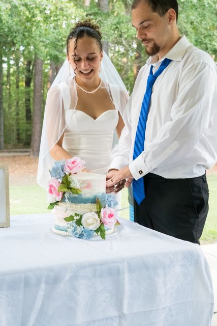 Newlyweds cutting their cake