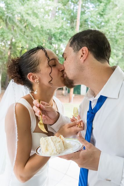 Newlyweds sharing wedding cake