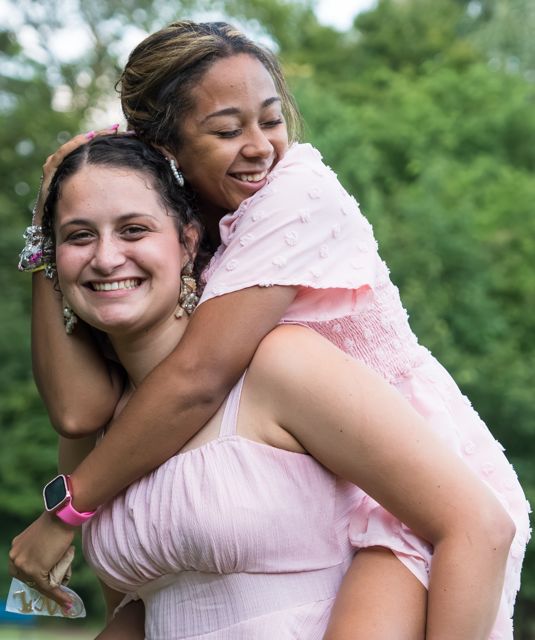 Wedding guests sharing a playful moment