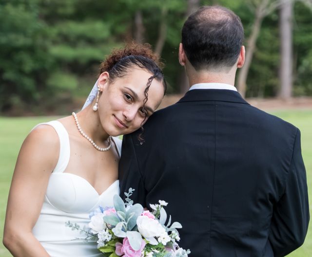 Bride and groom sharing a quiet moment outdoors
