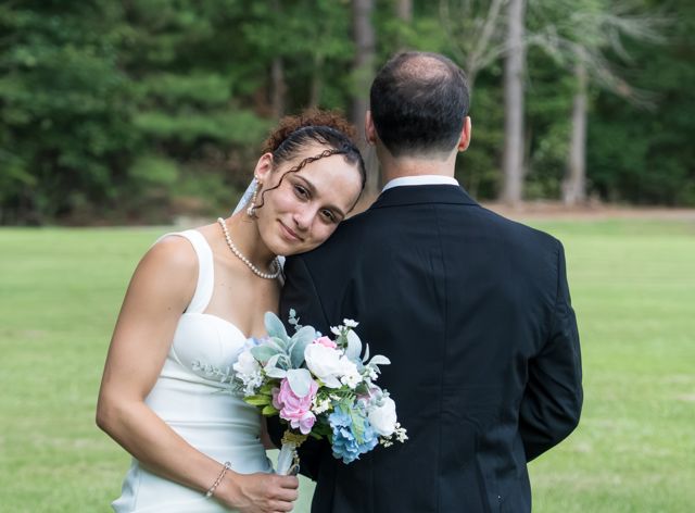 Bride and groom sharing a quiet moment outdoors