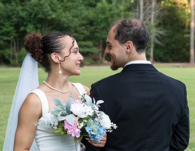 Bride and groom sharing a quiet moment outdoors
