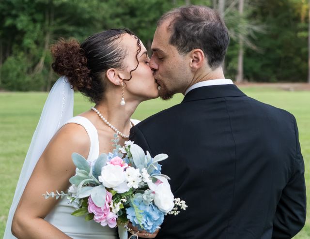 Bride and groom sharing a quiet moment outdoors