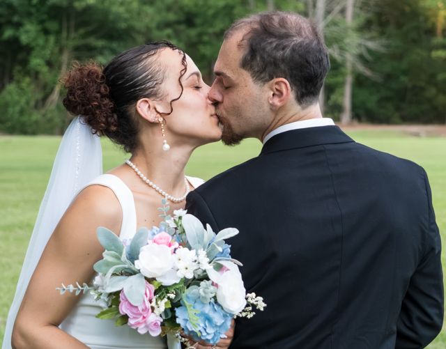 Bride and groom sharing a quiet moment outdoors