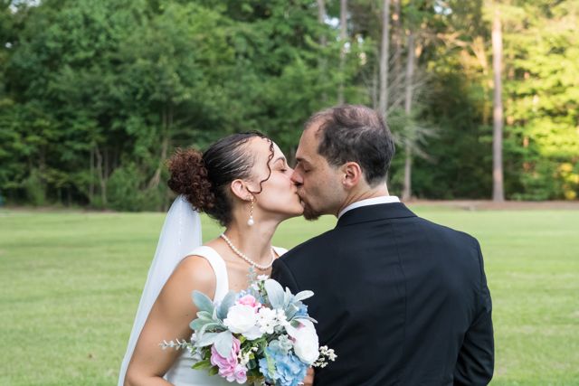 Bride and groom sharing a quiet moment outdoors