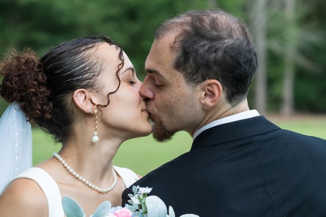 Bride and groom sharing a quiet moment outdoors