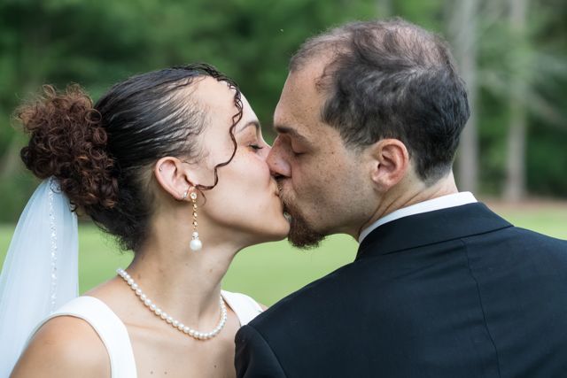 Bride and groom sharing a quiet moment outdoors