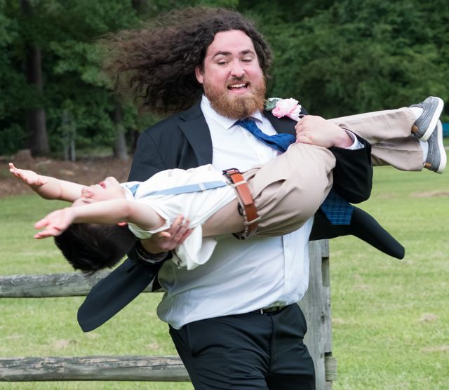 Wedding guests posing playfully